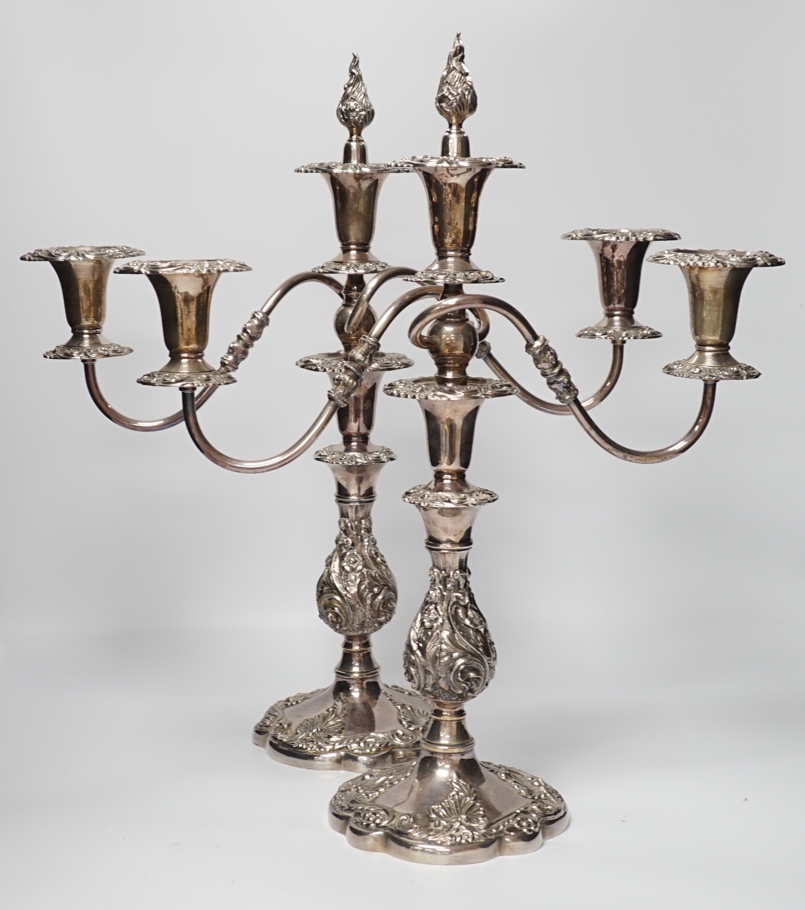 Two silver plated two branch three light candelabra, 49cm high